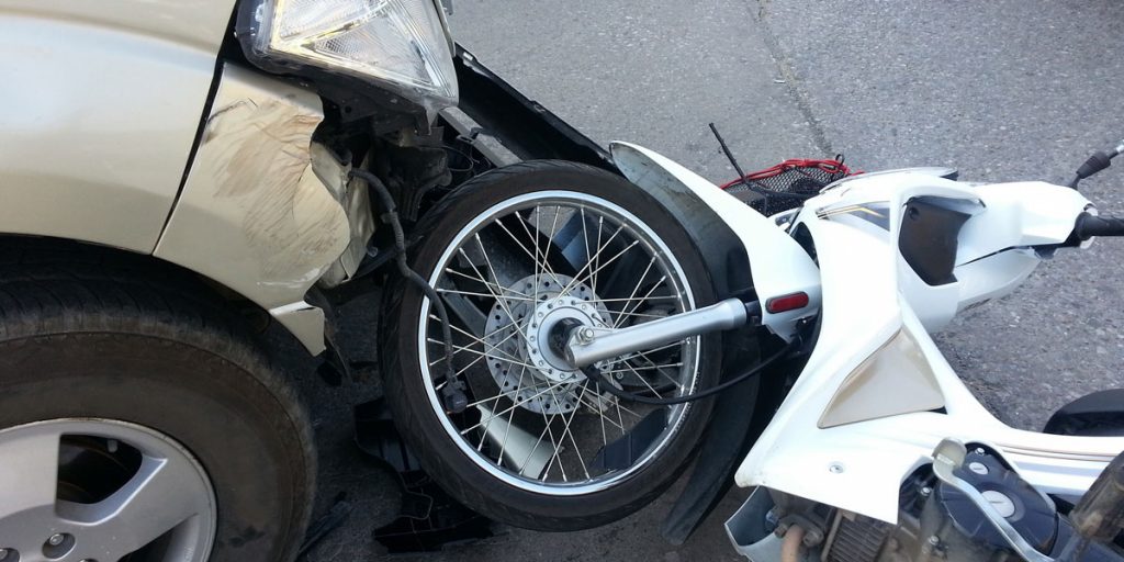 motorcycle crashed into front end of passenger car