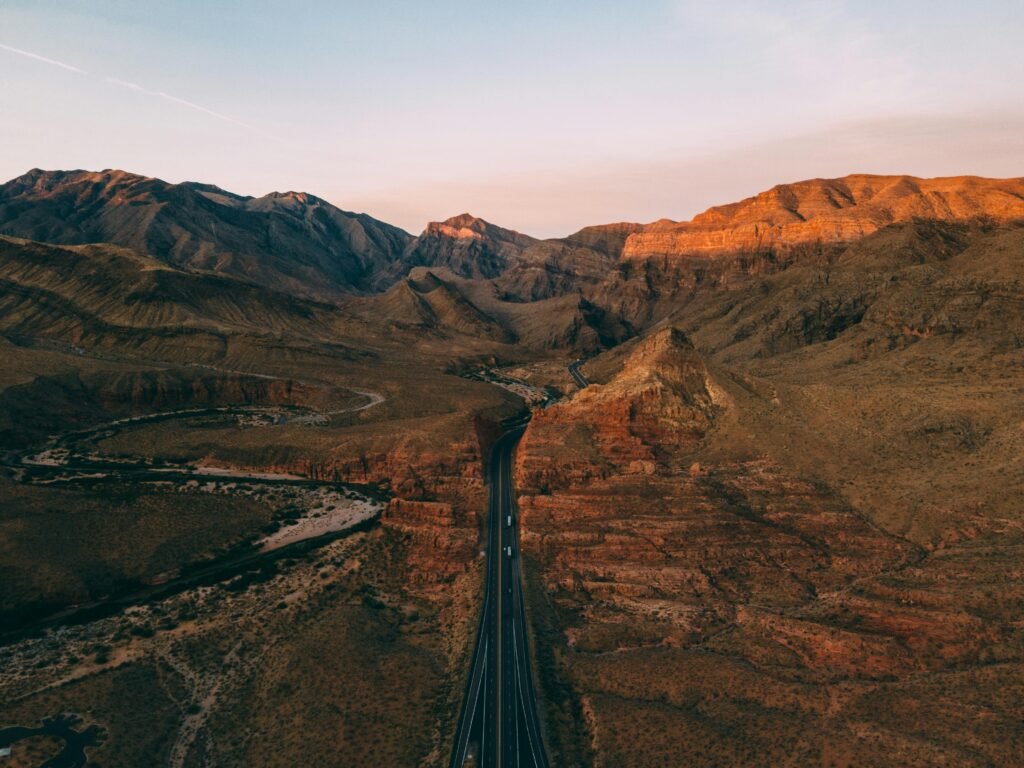 Aerial view of a highway winding through Arizona's desert mountains, symbolizing the complex and often misunderstood journey of arizona personal injury claims.
