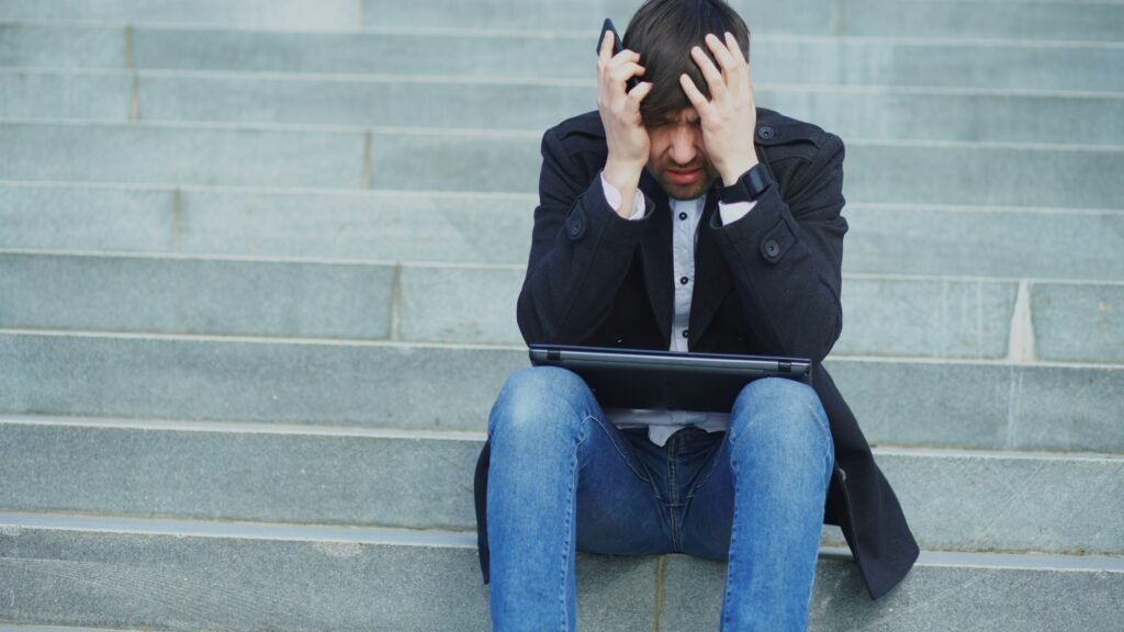 Frustrated person standing on courthouse steps in Arizona after a personal injury case, highlighting concerns about legal representation.