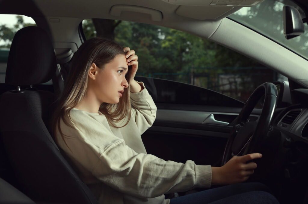 Transparency in Rideshare: How Much Does Uber Really Cost for Drivers and Riders? Rideshare driver behind the wheel looking stressed, highlighting transparency concerns in rideshare insurance and pricing