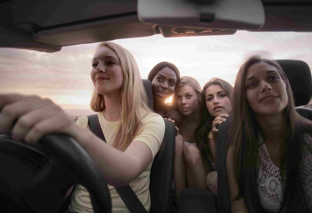 Teen girls driving together during summer road trip season associated with the 100 deadliest days of driving.