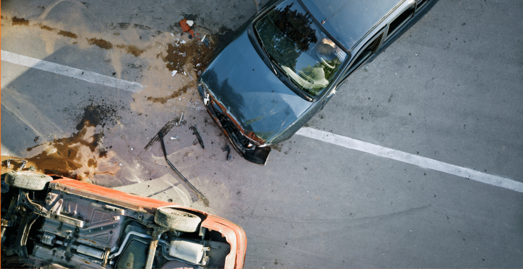 Car accident lawyer in Henderson NV guide showing an overhead view of a two-vehicle collision at an intersection